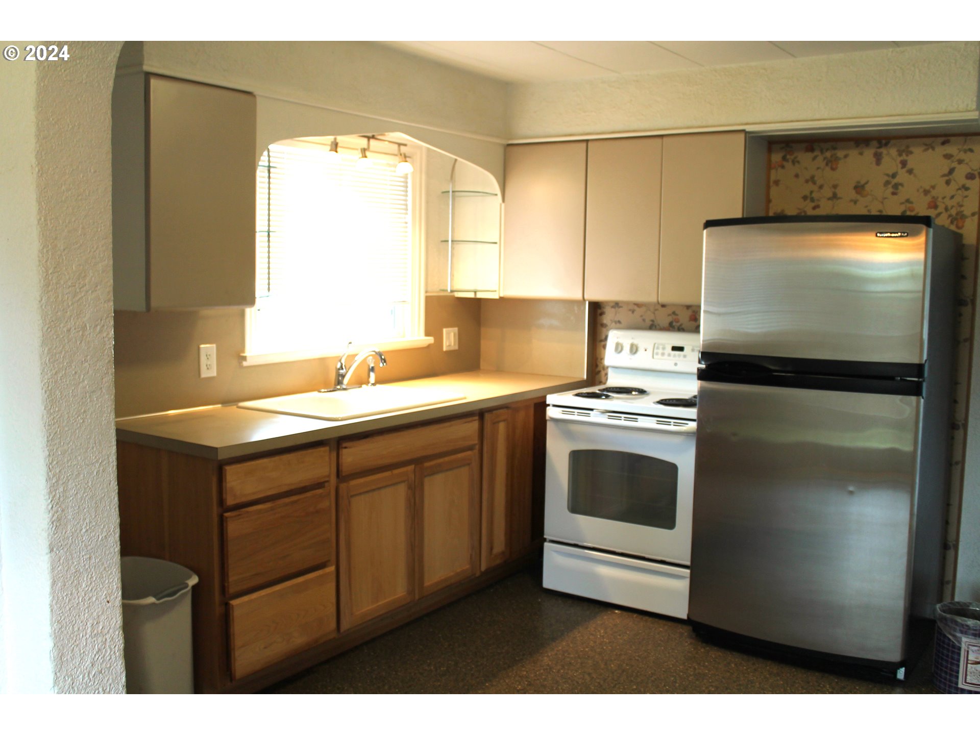 757 South Bridge Street Prairie City, OR 97869 - Photo 14 of 19 a kitchen with a sink appliances and cabinets