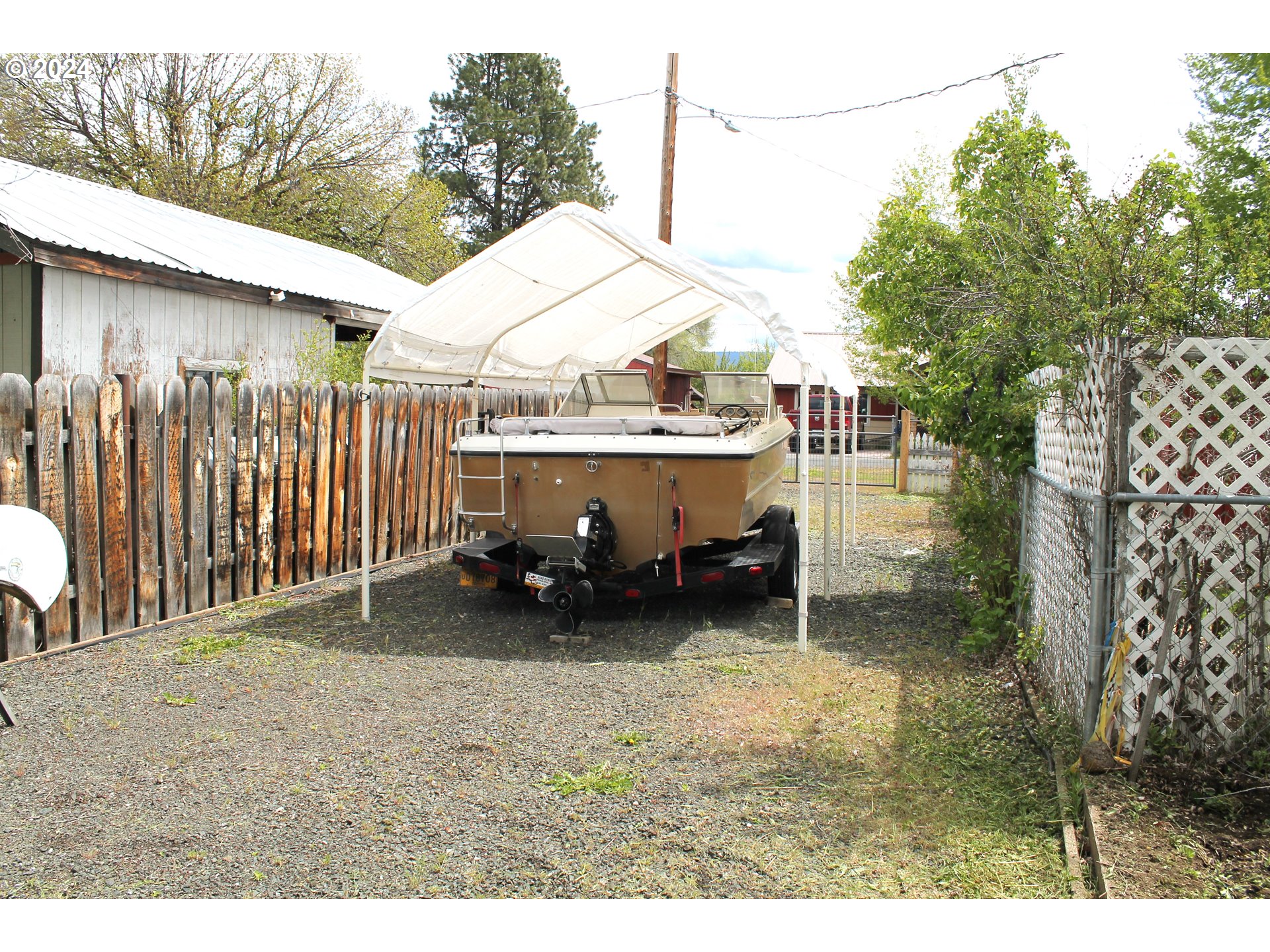 757 South Bridge Street Prairie City, OR 97869 - Photo 2 of 19 a backyard of a house with barbeque oven and outdoor seating