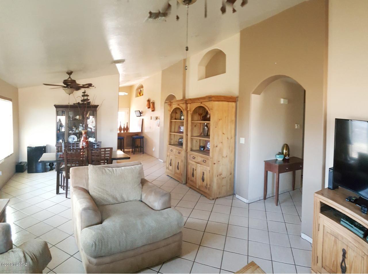 1399 Via Patricia Rio Rico, AZ 85648 - Photo 6 of 9 a living room with fireplace furniture and a flat screen tv