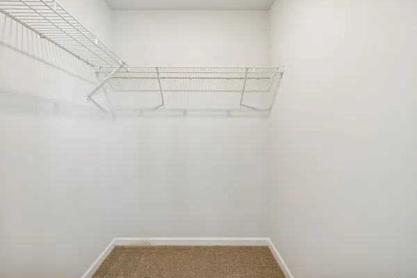 a bathroom with a sink a toilet and a large mirror