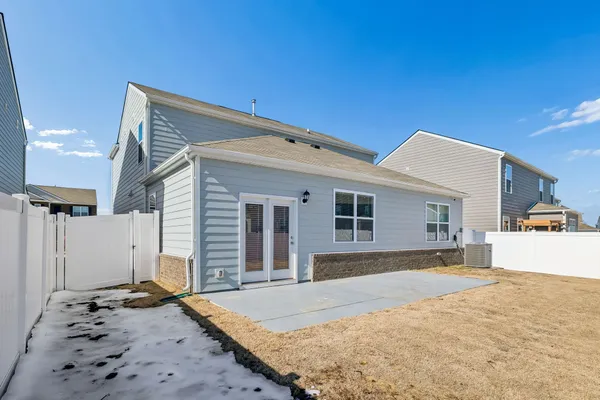 a view of a house with a yard and garage