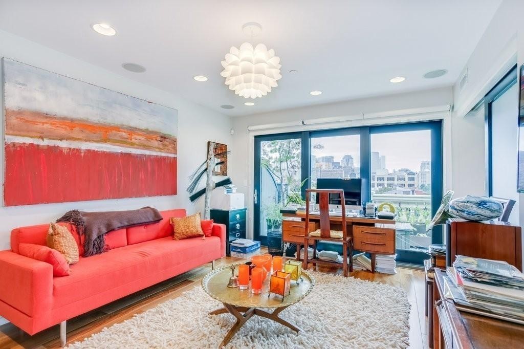 79 Chandler Street, Unit 9 Boston, MA 02116 - Photo 11 of 19 a living room with furniture a rug and a large window