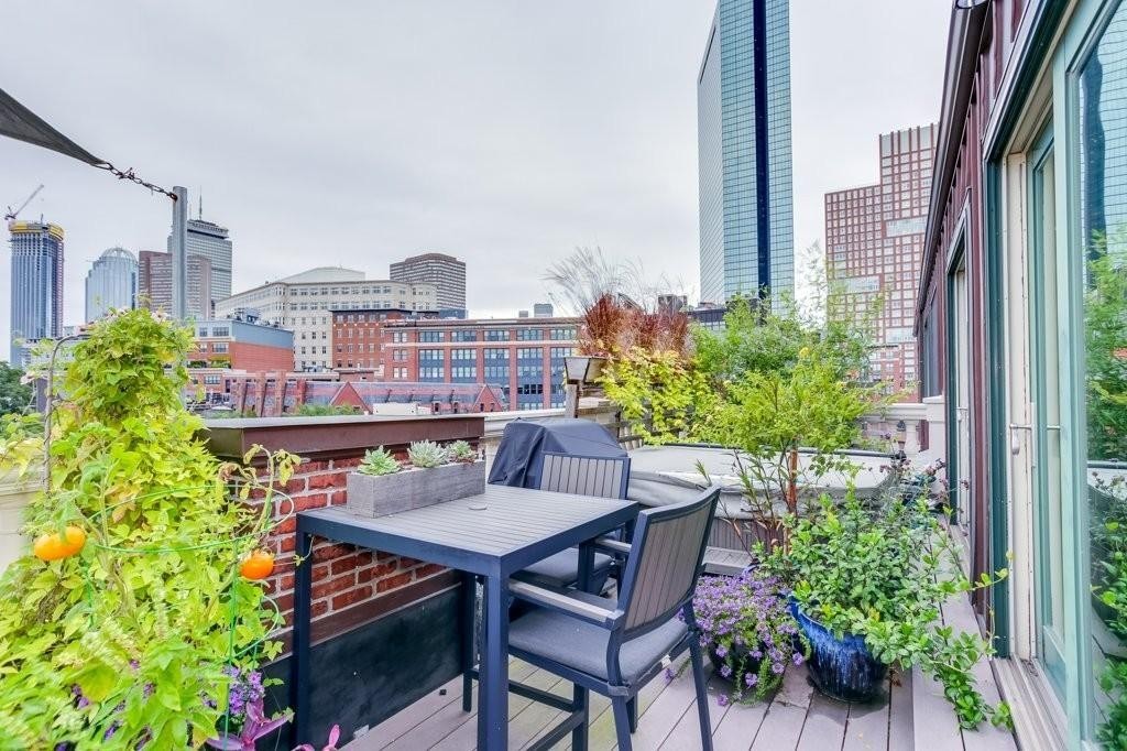 79 Chandler Street, Unit 9 Boston, MA 02116 - Photo 16 of 19 a view of a balcony with furniture and a potted plant
