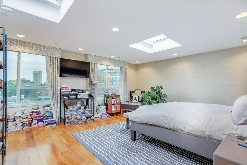 79 Chandler Street, Unit 9 Boston, MA 02116 - Photo 9 of 19 a living room with furniture and a flat screen tv