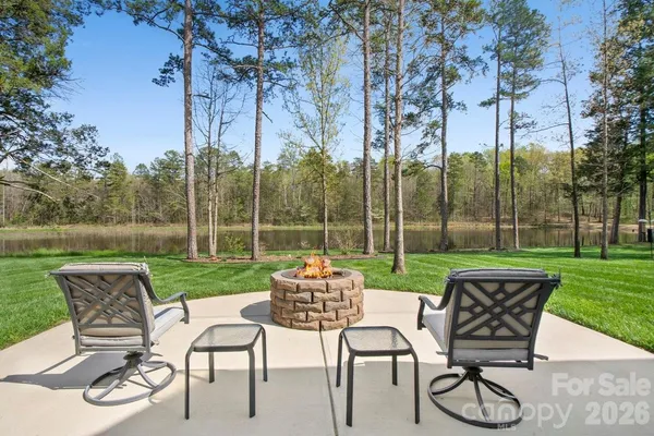 a view of a chairs and table in the yard