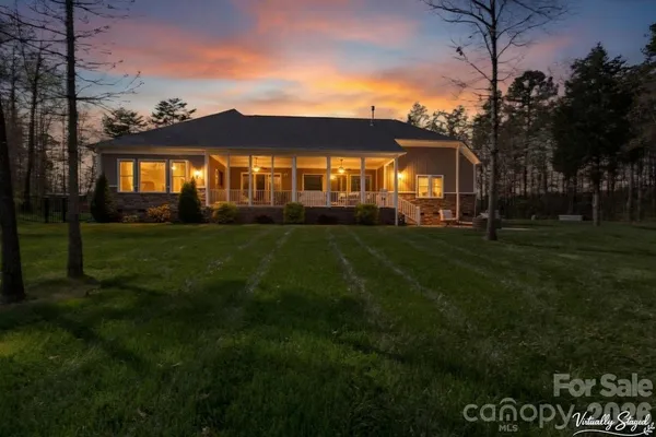a view of a house with a big yard