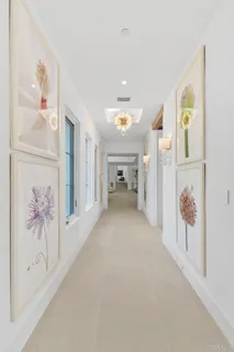 a view of an empty room with painting on the wall