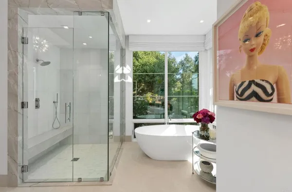 a bathroom with double sink and a mirror