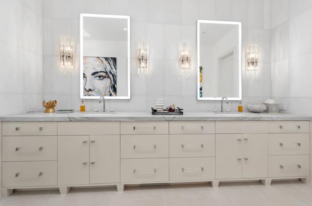 5315 La Crescenta Road Rancho Santa Fe, CA 92067 - Photo 18 of 34 a bathroom with double sink and a mirror
