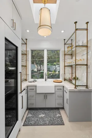 a large white kitchen with a window