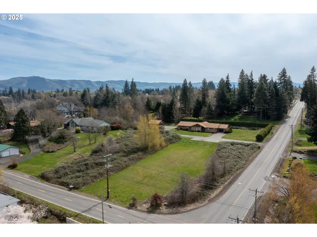 a view of a swimming pool with a yard