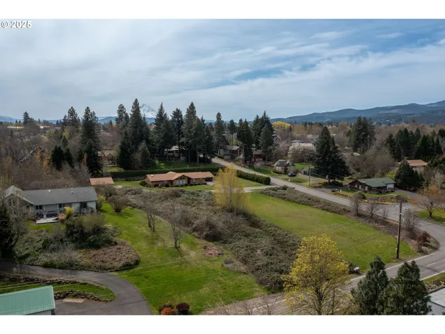 a view of a lake with houses in the back