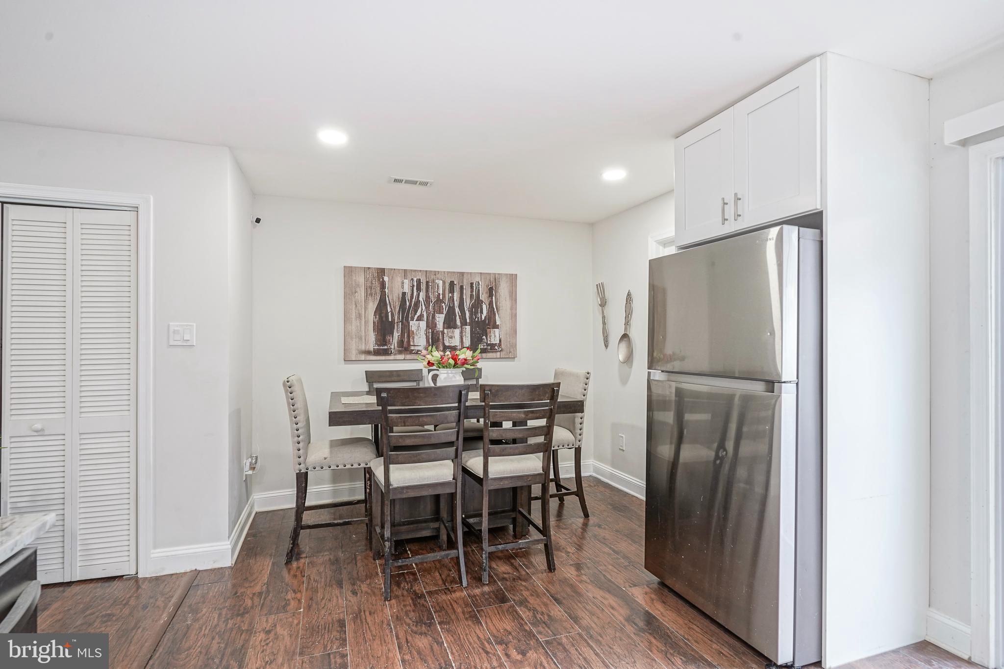 48 Memphis Court Sicklerville, NJ 08081 - Photo 11 of 28 a kitchen with stainless steel appliances a refrigerator a table and chairs