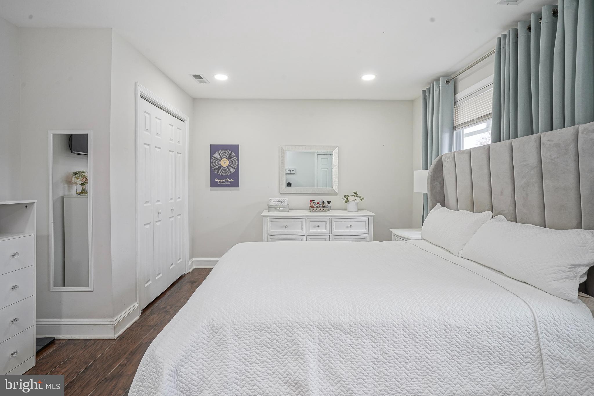 48 Memphis Court Sicklerville, NJ 08081 - Photo 16 of 28 a bedroom with a bed and a large mirror