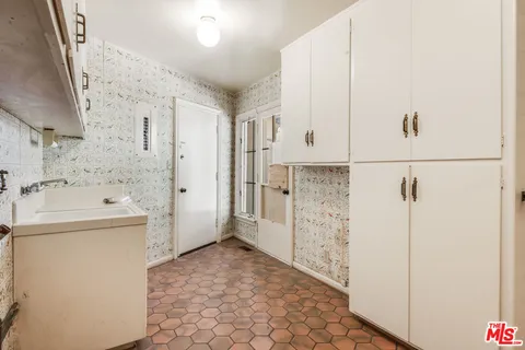 a view of a bathroom with a sink and a shower