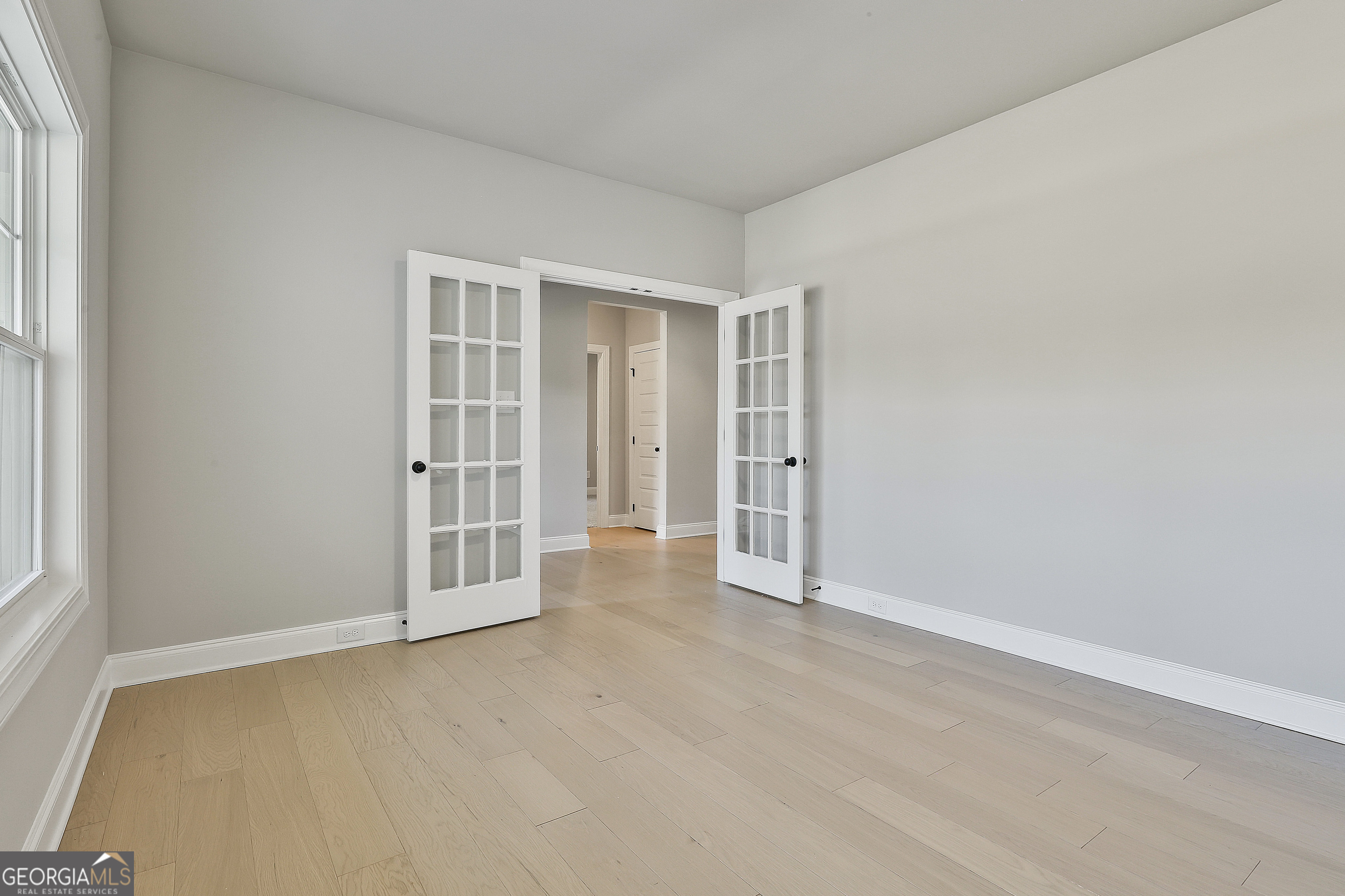 16 Nelson Way, Unit 38 Williamson, GA 30292 - Photo 11 of 44 an empty room with windows