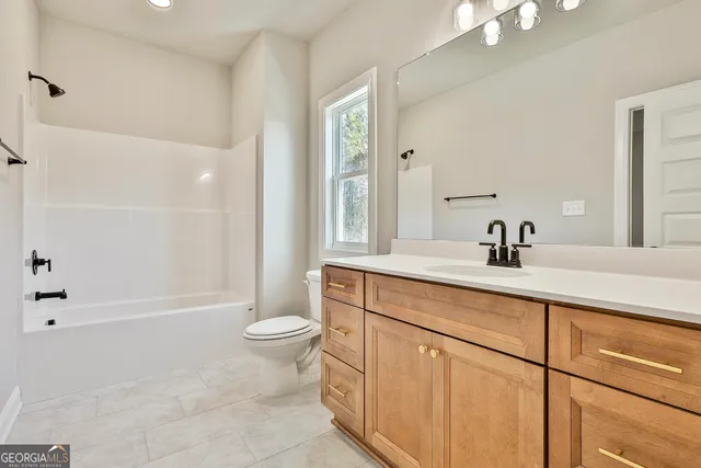 a view of a kitchen with a sink and a window