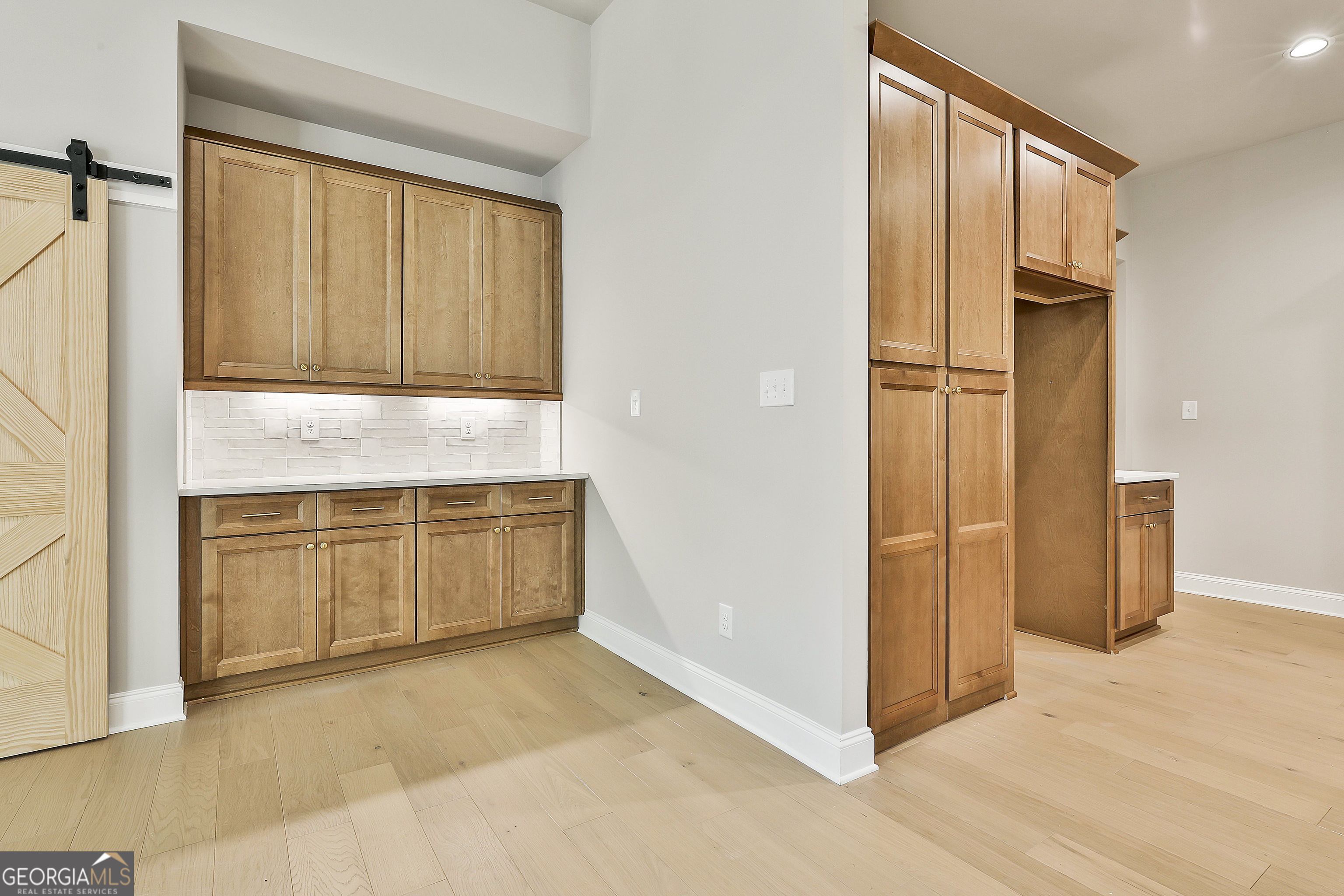 16 Nelson Way, Unit 38 Williamson, GA 30292 - Photo 19 of 44 a view of a kitchen with an empty space and a window