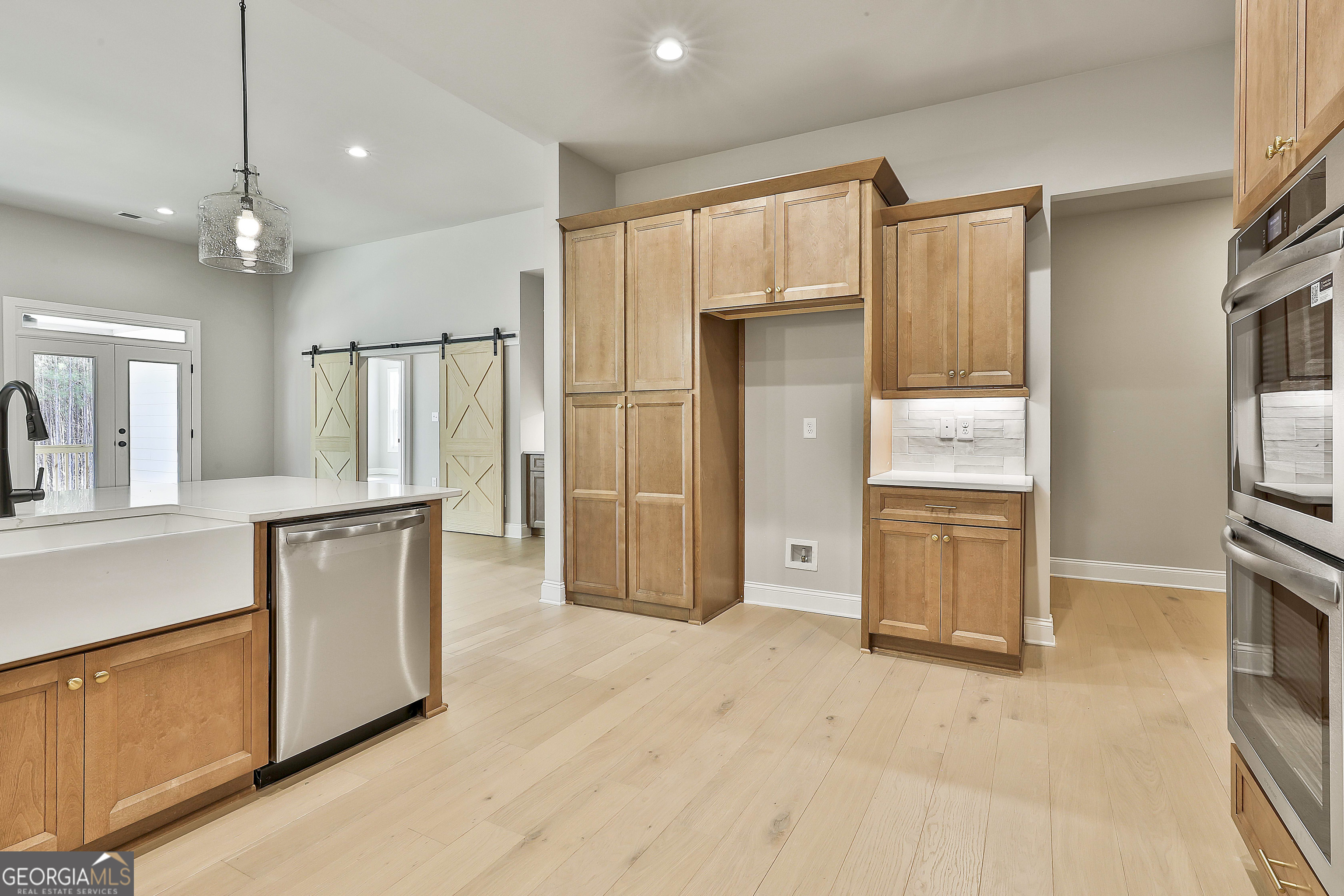 16 Nelson Way, Unit 38 Williamson, GA 30292 - Photo 23 of 44 a view of a kitchen with refrigerator and wooden floor