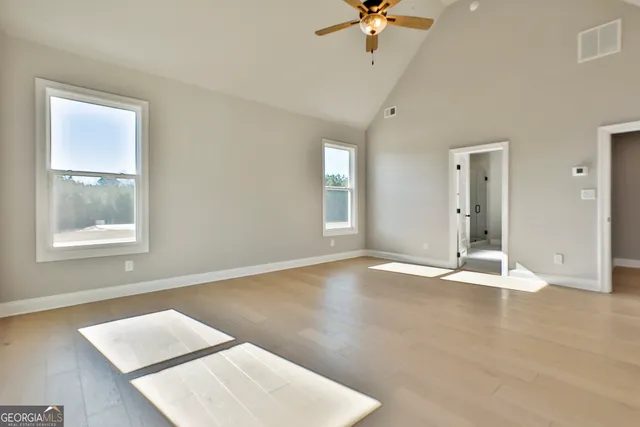 a bathroom with double sink and a mirror