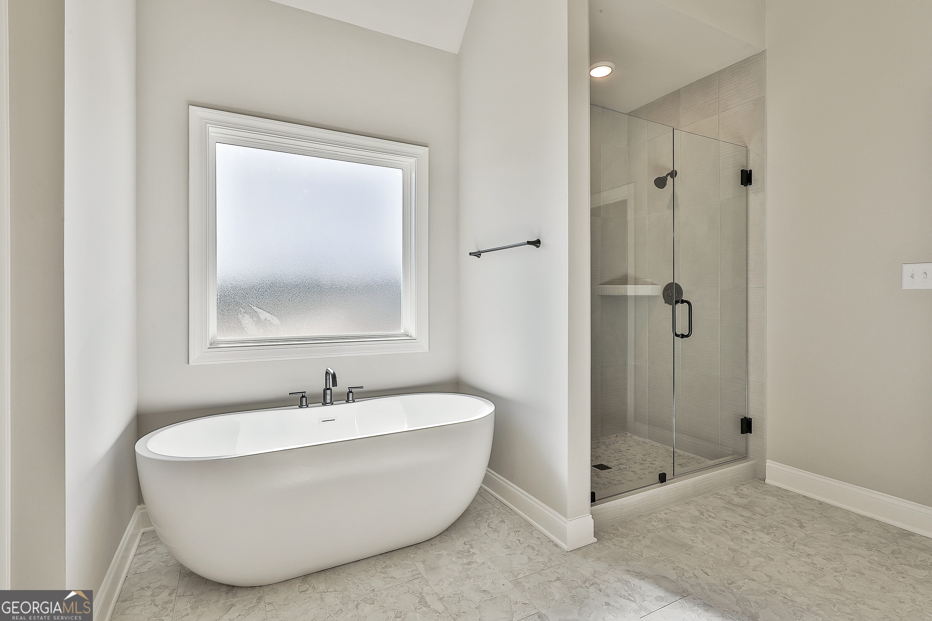 16 Nelson Way, Unit 38 Williamson, GA 30292 - Photo 30 of 44 a bathroom with a bathtub and shower