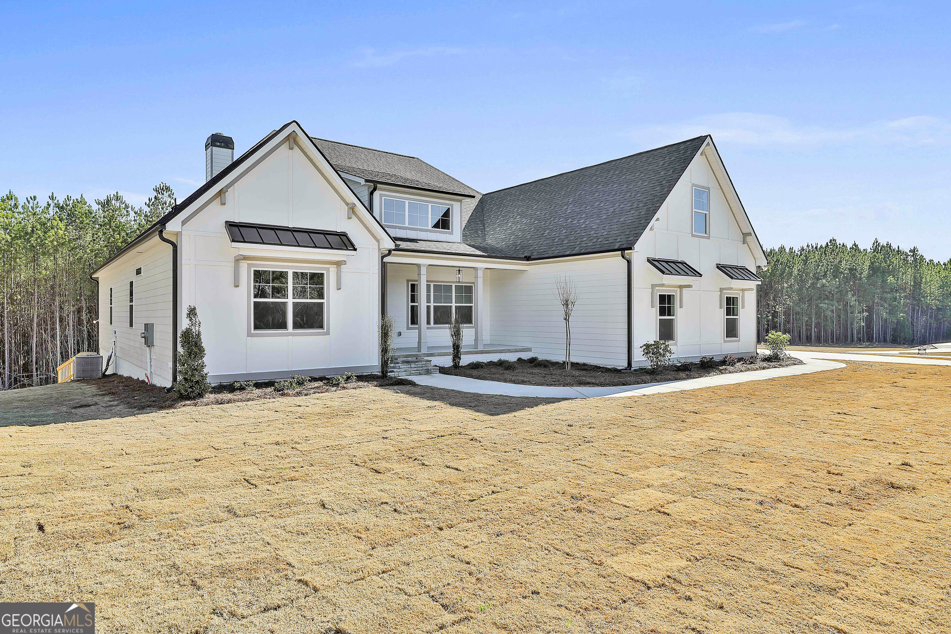 16 Nelson Way, Unit 38 Williamson, GA 30292 - Photo 3 of 44 a view of a house with snow on the ground