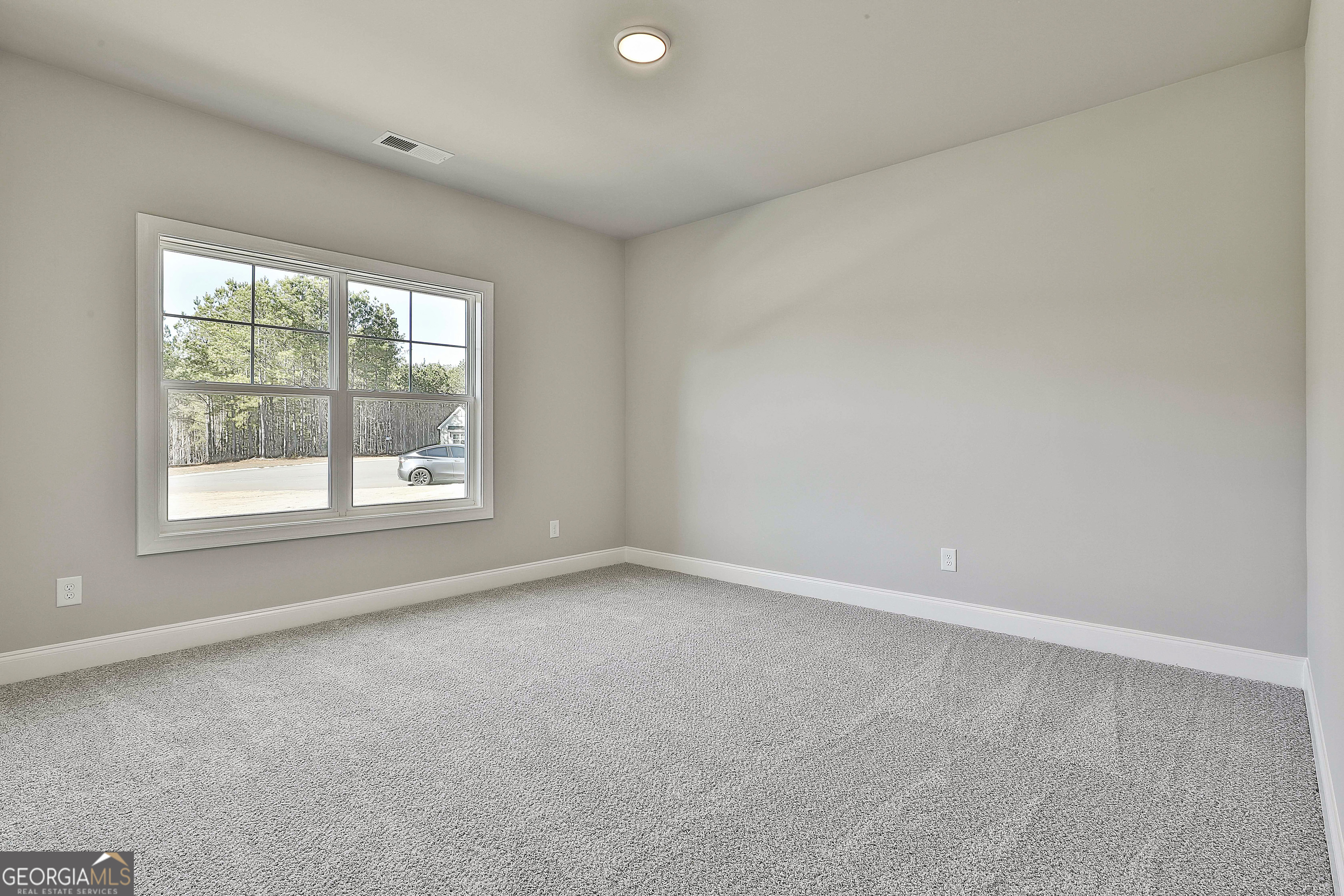 16 Nelson Way, Unit 38 Williamson, GA 30292 - Photo 33 of 44 an empty room with a window
