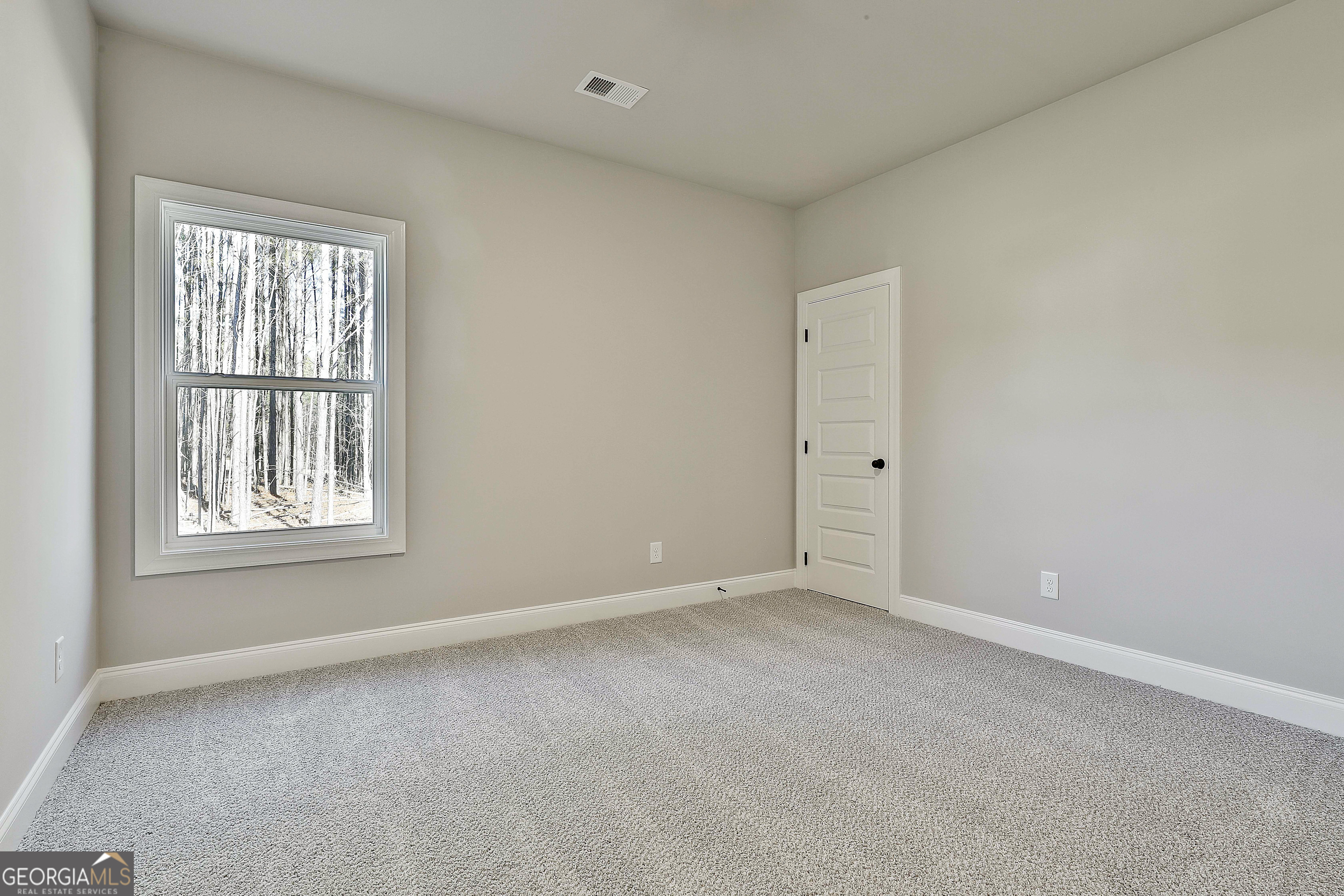 16 Nelson Way, Unit 38 Williamson, GA 30292 - Photo 35 of 44 an empty room with windows