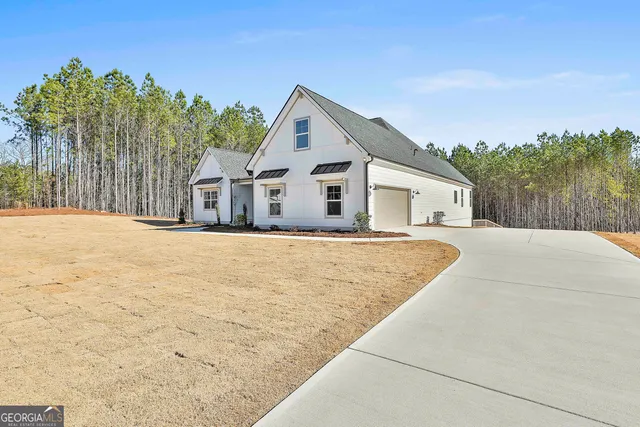 a view of house with palm trees