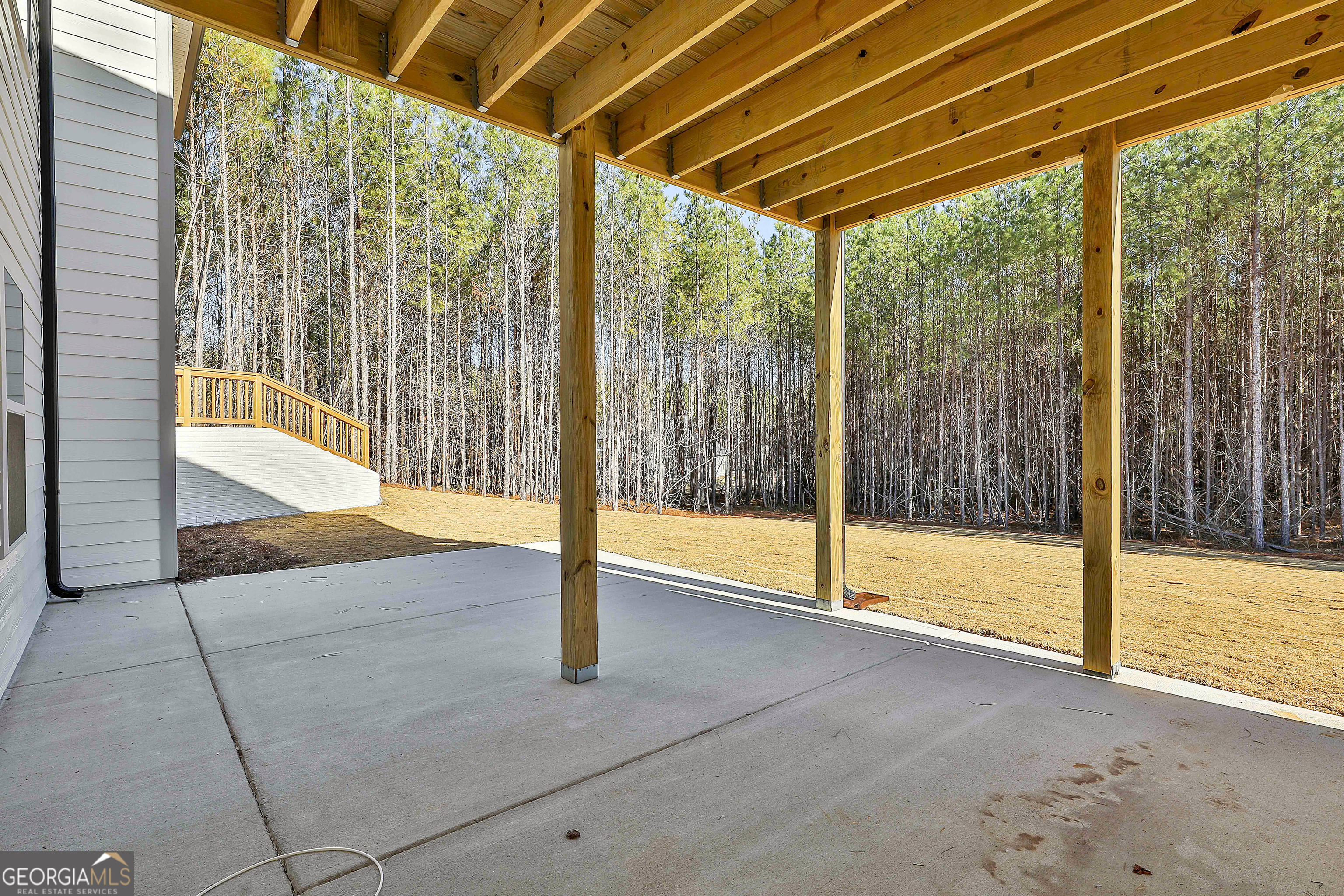 16 Nelson Way, Unit 38 Williamson, GA 30292 - Photo 41 of 44 a view of an empty room with wooden floor and door