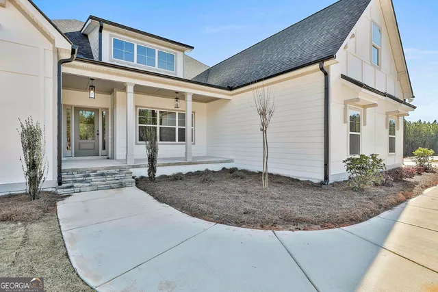 a view of a hallway with a wooden door
