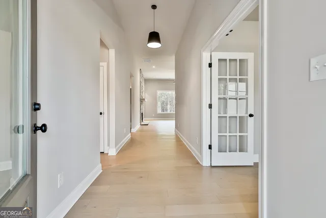 a view of an entryway of a house and wooden floor in a house