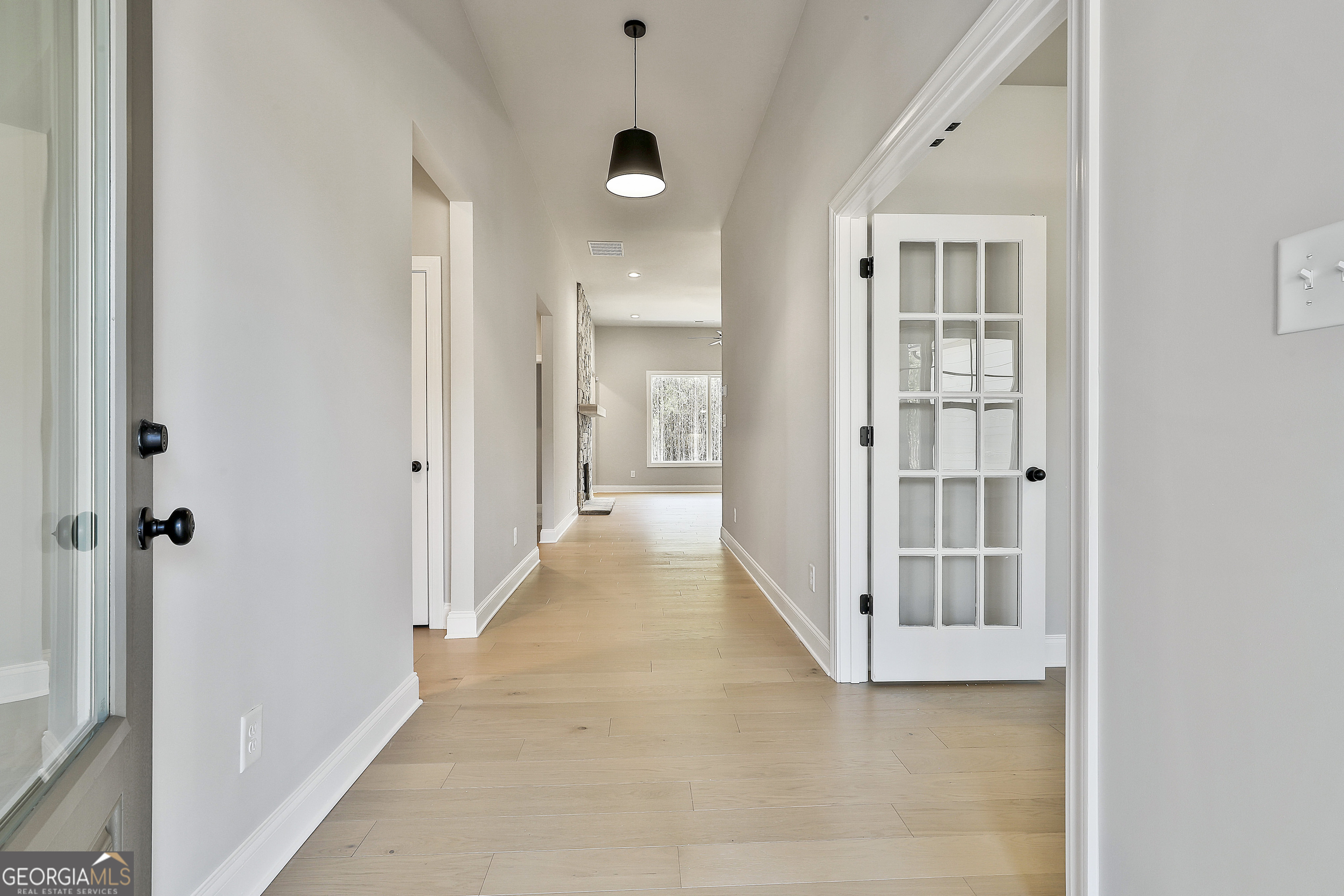 16 Nelson Way, Unit 38 Williamson, GA 30292 - Photo 7 of 44 a view of a hallway with a wooden door