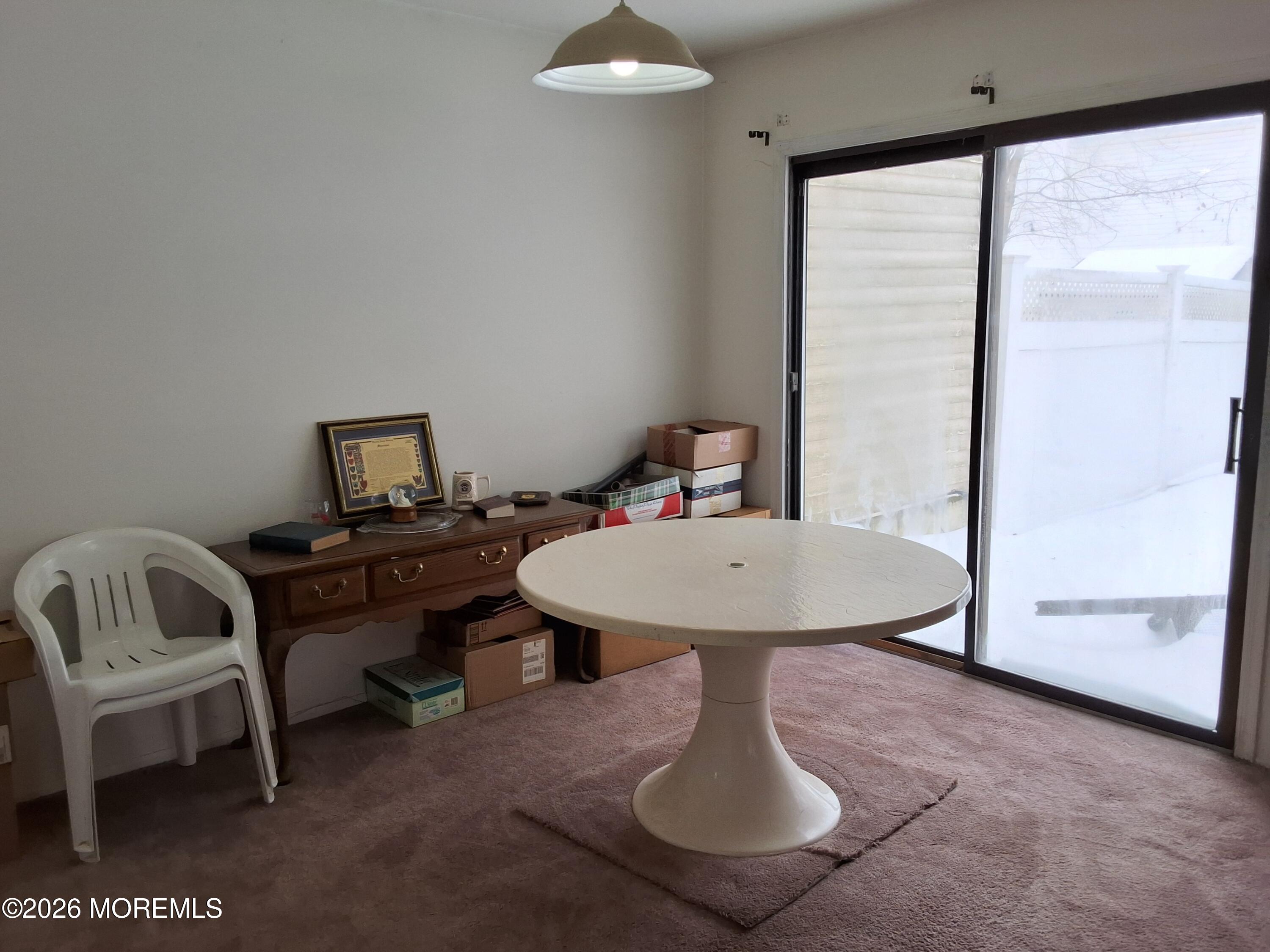 12 Coventry Court, Unit 12 Matawan, NJ 07747 - Photo 13 of 21 a view of a room with a table and chairs