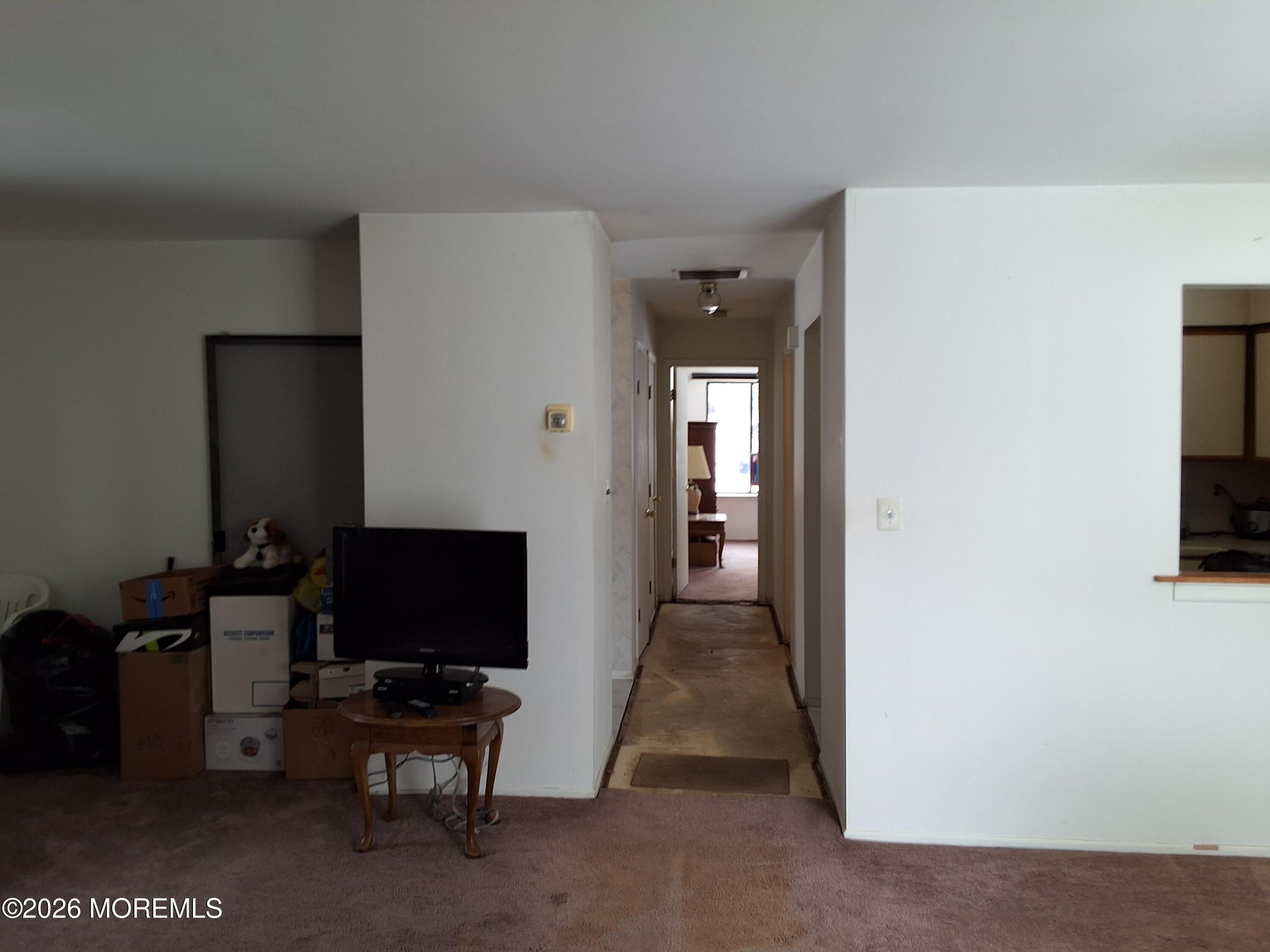 12 Coventry Court, Unit 12 Matawan, NJ 07747 - Photo 14 of 21 a living room with furniture and a flat screen tv