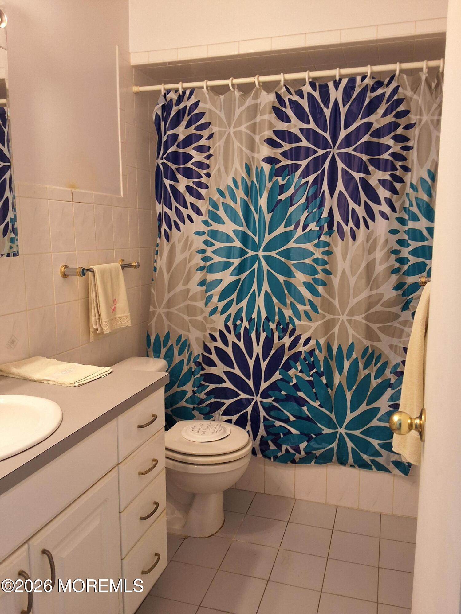 12 Coventry Court, Unit 12 Matawan, NJ 07747 - Photo 15 of 21 a bathroom with a sink a mirror and a potted plant