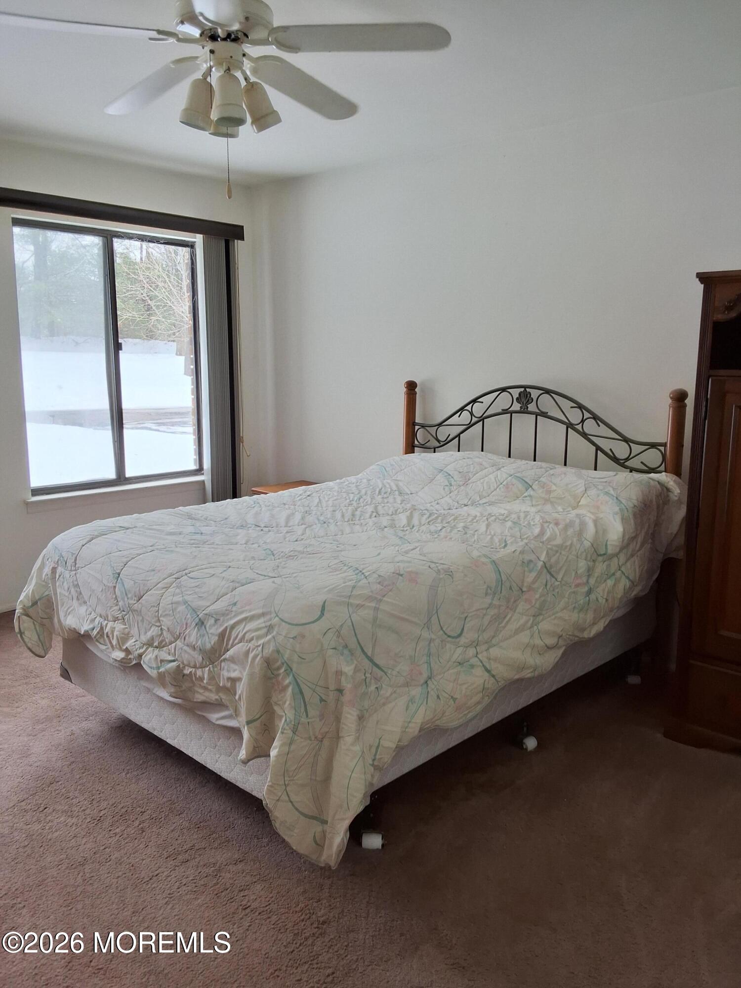12 Coventry Court, Unit 12 Matawan, NJ 07747 - Photo 16 of 21 a bedroom with a bed and window