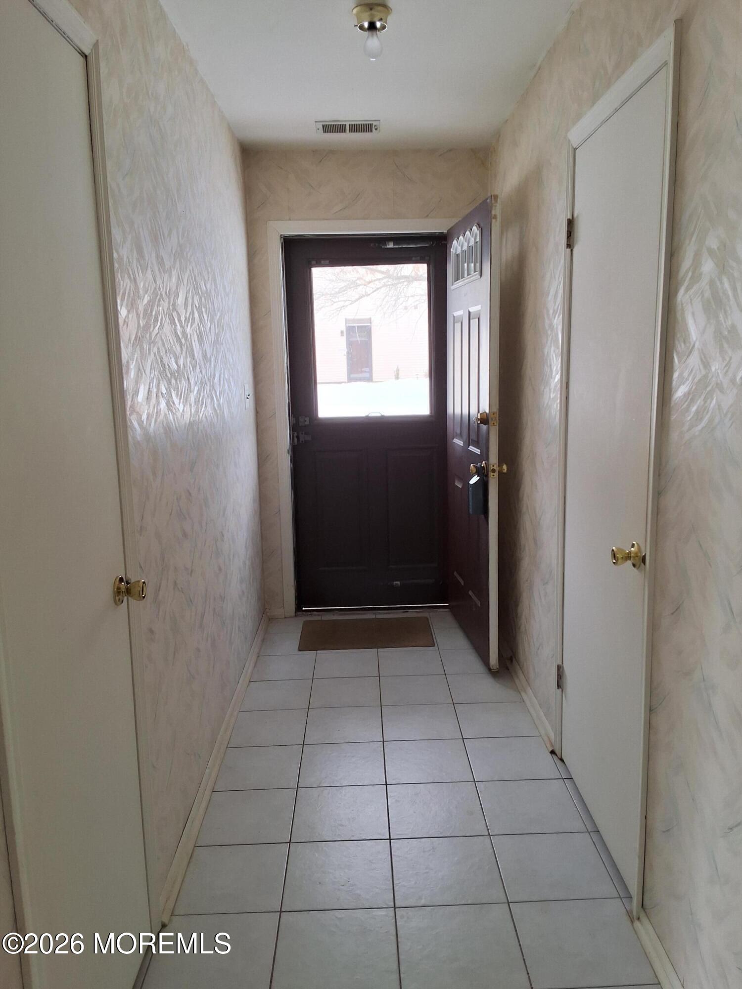 12 Coventry Court, Unit 12 Matawan, NJ 07747 - Photo 4 of 21 a view of an entryway door