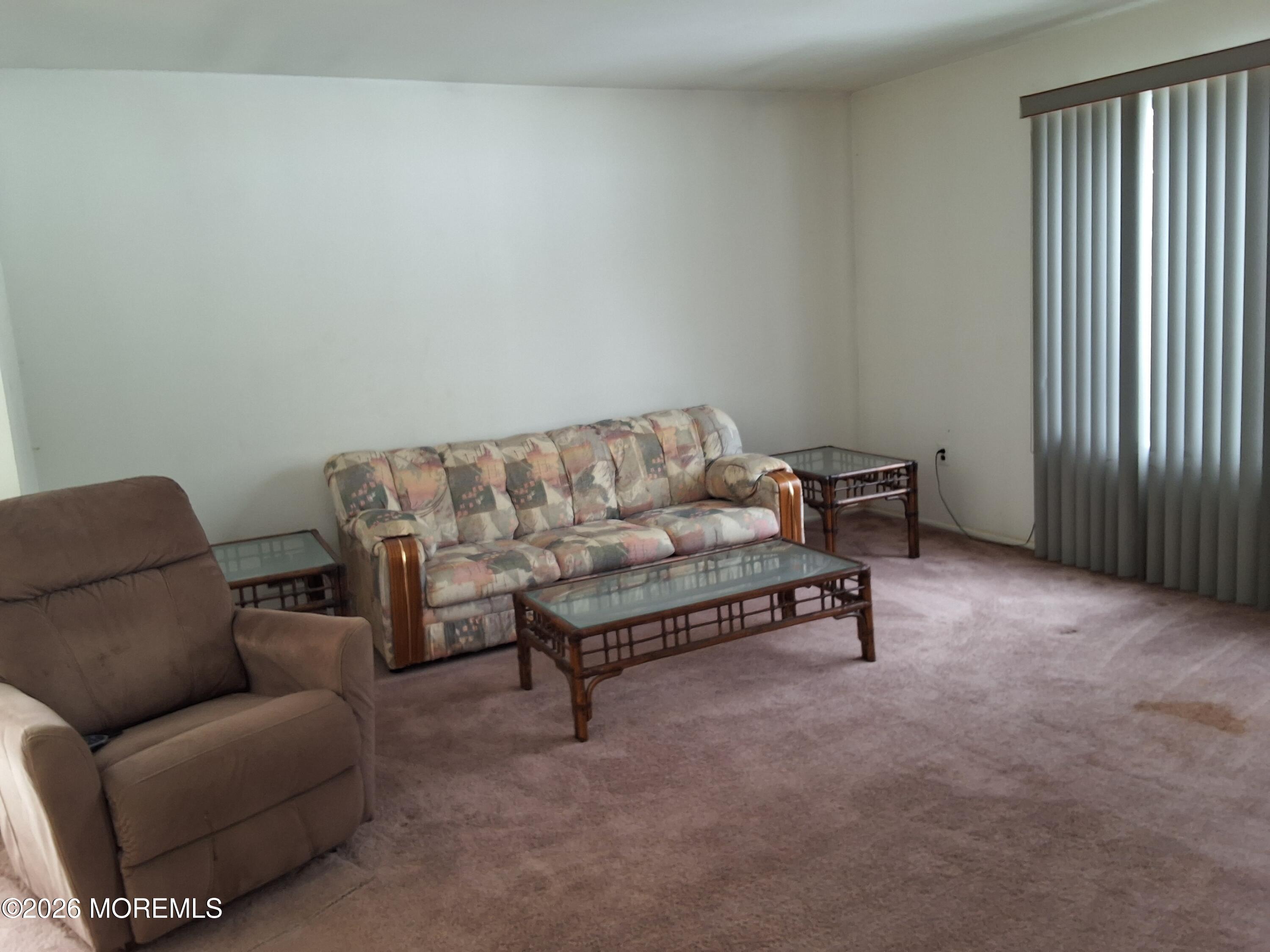 12 Coventry Court, Unit 12 Matawan, NJ 07747 - Photo 10 of 21 a living room with furniture and a window