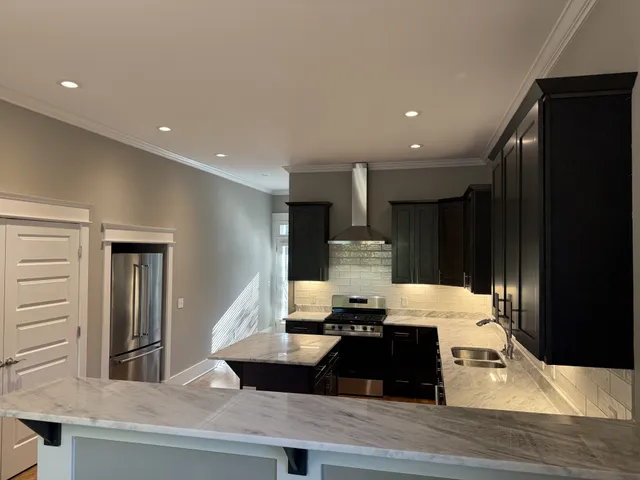 a room with a large window and furniture