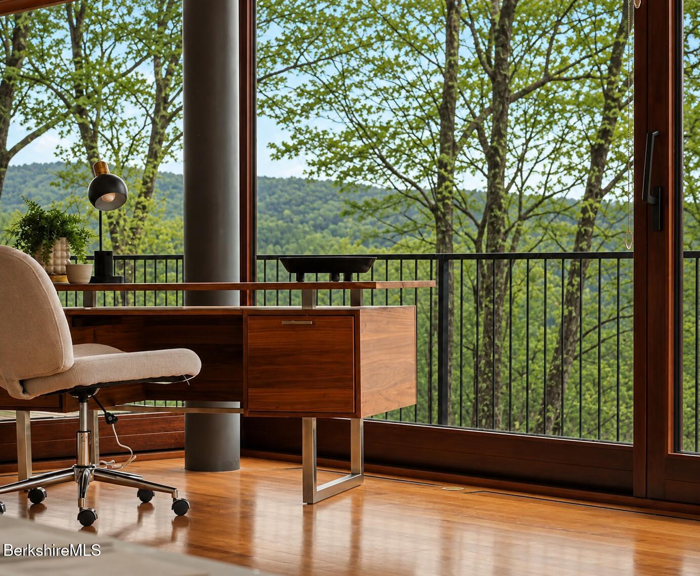 250 Long Pond Road Great Barrington, MA 01230 - Photo 28 of 56 a balcony with table and chairs