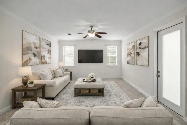 a living room with furniture and a flat screen tv
