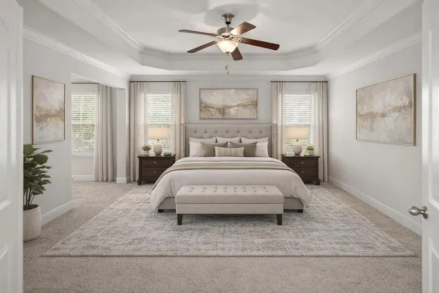 a spacious bedroom with a bed and ceiling fan