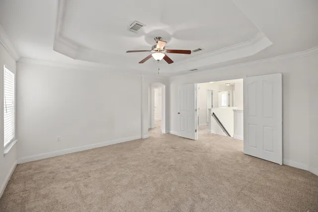 a view of empty room with ceiling fan