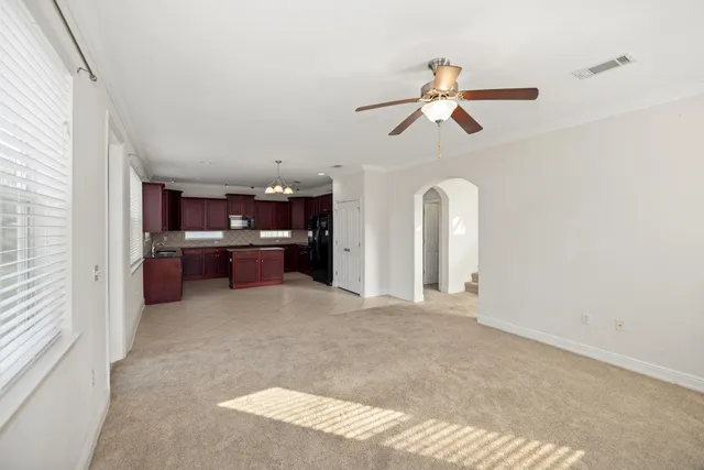 a view of a kitchen with a sink and cabinet area
