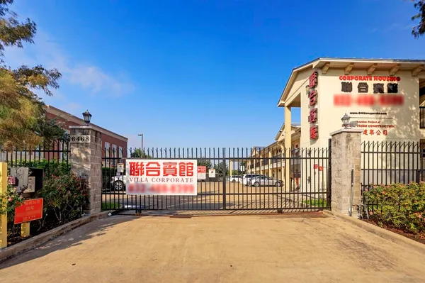 a view of a wrought iron fences in front of house