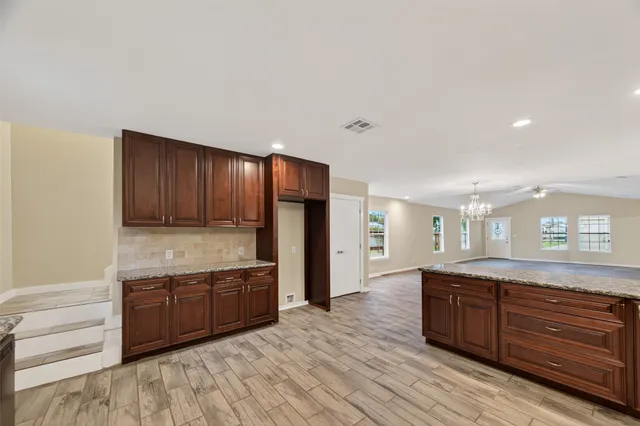 a kitchen with lots of counter space and a sink