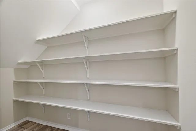 a kitchen with stainless steel appliances granite countertop a stove and a wooden cabinets