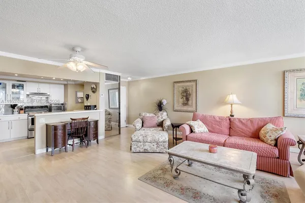 a living room with furniture and a lamp