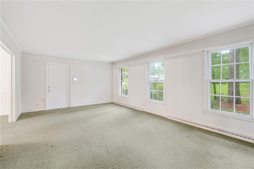 1911 Alderbrook Road Northeast Atlanta, GA 30345 - Photo 7 of 33 an empty room with windows